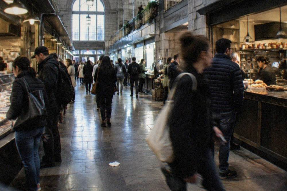 Long granite market hall interior with central walkway and food counters on both sides